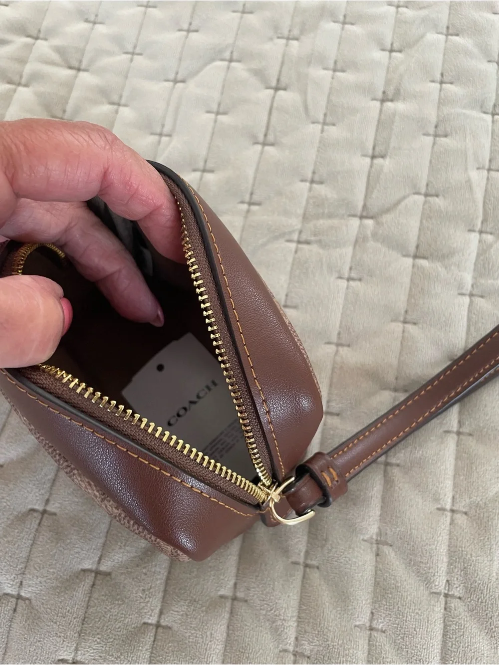 Coach Brown and Tan Interior Zip Pouch wristlet with Gold Hardware